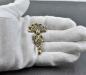 Preview: Gotische Siebenknopffibel aus Bronze von Belanas Schatzkiste auf Hand